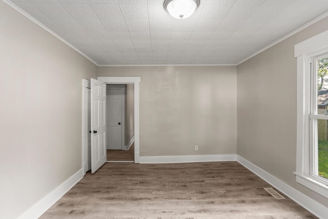 510 S Cottage Grove Ave, Urbana, IL 61802 - spare room with ornamental molding and light wood-style flooring