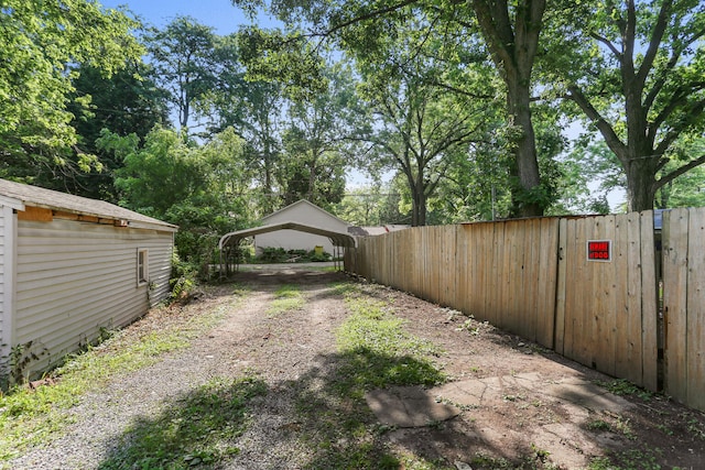 510 S Cottage Grove Ave, Urbana, IL 61802 - view of yard with a carport and driveway