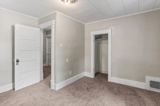 510 S Cottage Grove Ave, Urbana, IL 61802 - unfurnished bedroom featuring carpet floors, ornamental molding, and a closet