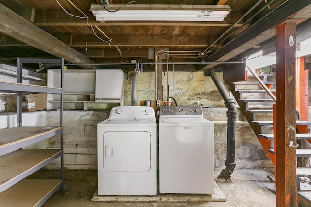 510 S Cottage Grove Ave, Urbana, IL 61802 - unfinished basement featuring washing machine and clothes dryer and stairway