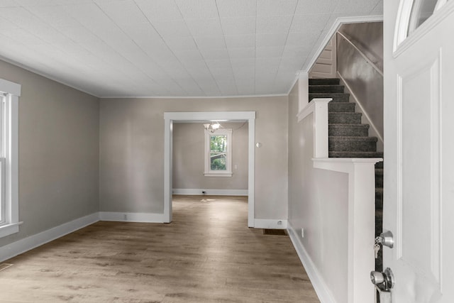510 S Cottage Grove Ave, Urbana, IL 61802 - empty room featuring ornamental molding, wood finished floors, and stairs