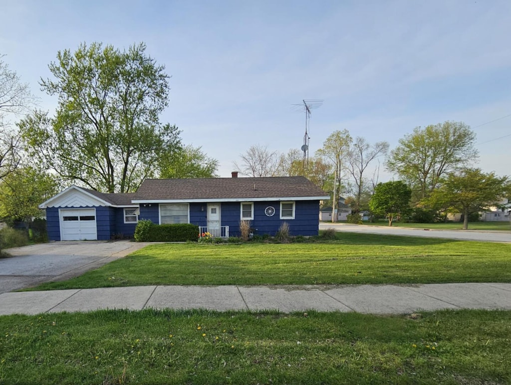 203 W Morris St, Elwood, IL 60421 - single story home featuring a front yard, an attached garage, concrete driveway, and a chimney