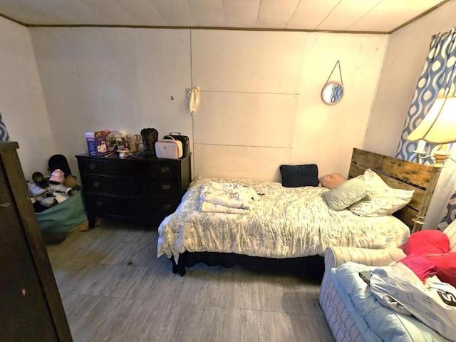bedroom with wood finished floors