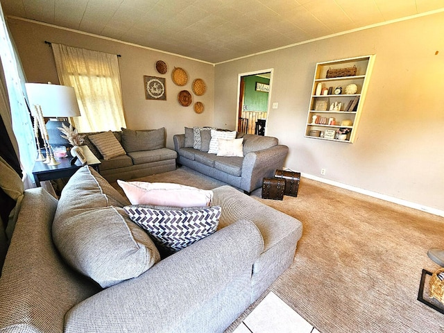 living room featuring ornamental molding, built in features, carpet floors, and baseboards