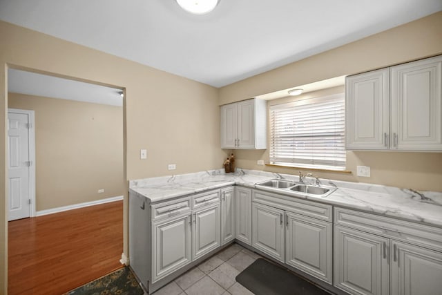 405 E 109th St Unit 203, Chicago, IL 60628 - kitchen featuring white cabinetry and light wood finished floors