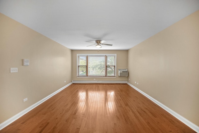 405 E 109th St Unit 203, Chicago, IL 60628 - empty room featuring ceiling fan, light wood-style floors, a wall mounted air conditioner, and baseboard heating