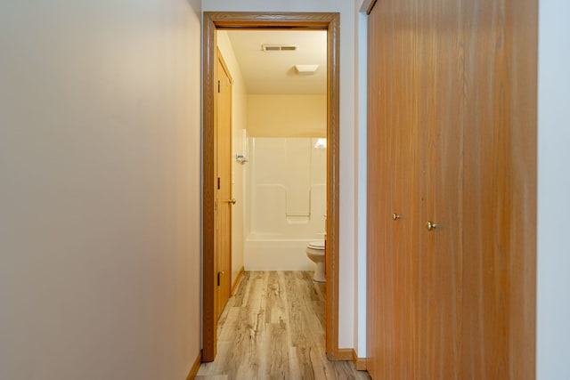 7480 Thomas Dr Unit 7480, Loves Park, IL 61111 - hallway with visible vents and light wood-type flooring