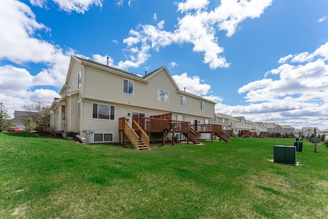 7480 Thomas Dr Unit 7480, Loves Park, IL 61111 - back of property with stairway, a deck, a yard, and a residential view