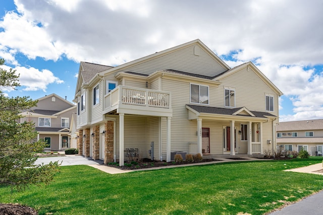 7480 Thomas Dr Unit 7480, Loves Park, IL 61111 - craftsman-style house featuring covered porch, a balcony, and a front yard