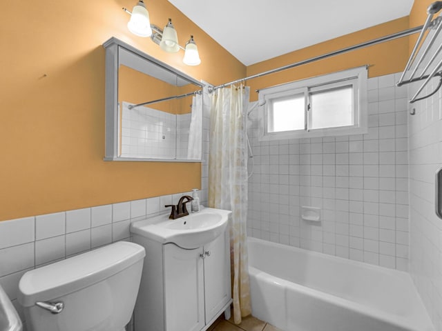 bathroom with vanity, shower / tub combo with curtain, and toilet