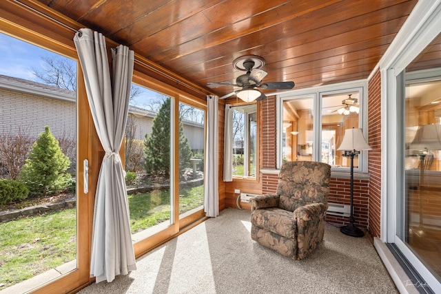 sunroom with wooden ceiling and carpet