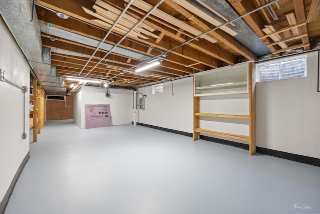 basement featuring baseboards