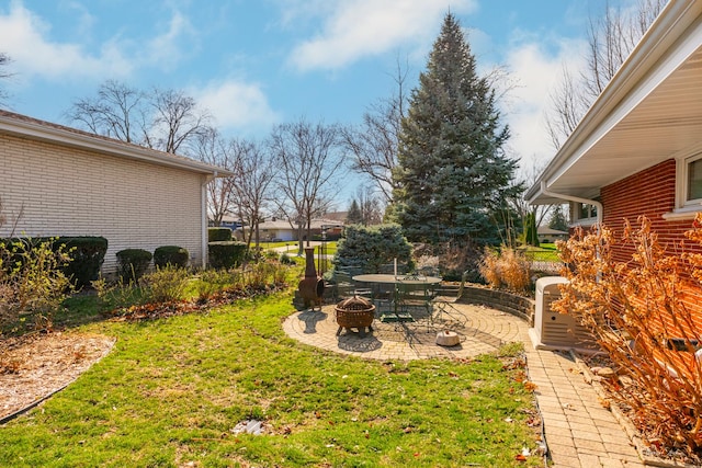 view of yard with a patio and a fire pit