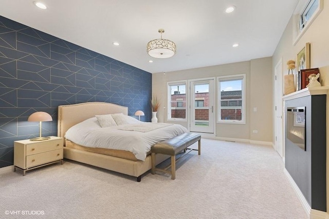 bedroom featuring recessed lighting, tile walls, and an accent wall