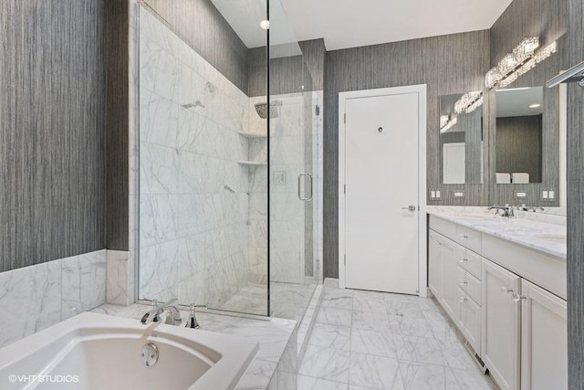 full bath with double vanity, a bath, a sink, marble finish floor, and tiled shower