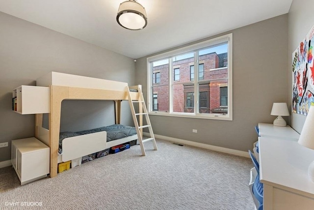 carpeted bedroom with baseboards