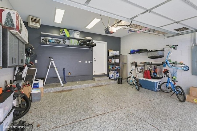 garage featuring a garage door opener and electric panel