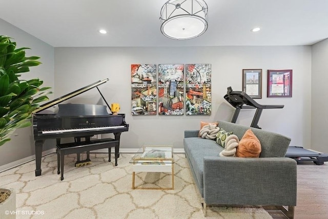living area with recessed lighting, baseboards, and wood finished floors