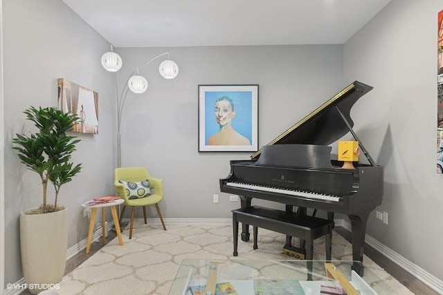 sitting room featuring baseboards