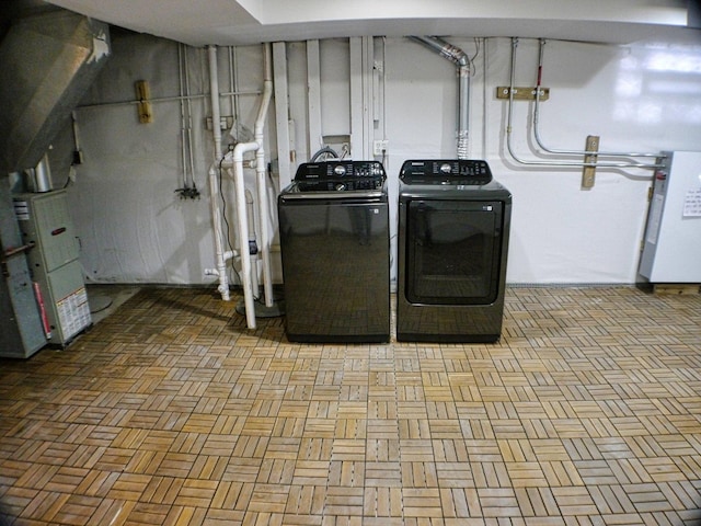 laundry area featuring separate washer and dryer and laundry area
