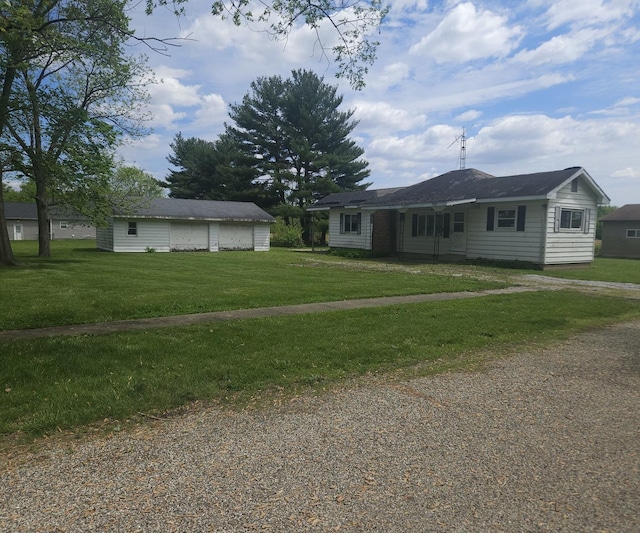 907 S Spruce St, Villa Grove, IL 61956 - ranch-style house featuring a garage, a front yard, and driveway