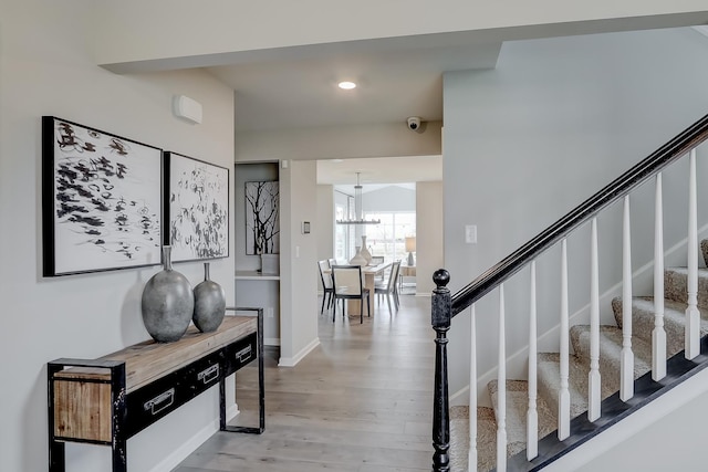 800 Cloverleaf Dr, Marengo, IL 60152 - foyer with recessed lighting, stairway, a chandelier, light wood-style floors, and baseboards