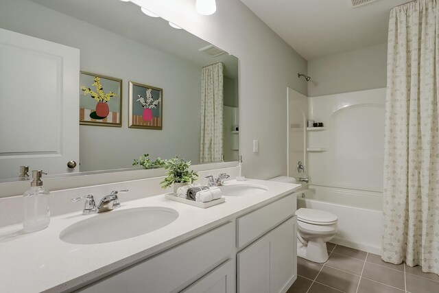 800 Cloverleaf Dr, Marengo, IL 60152 - full bath featuring shower / bath combo with shower curtain, toilet, tile patterned flooring, and a sink