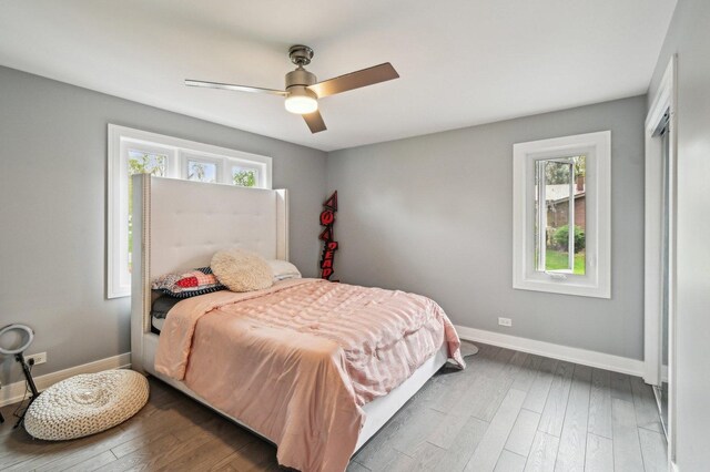 11702 Center Dr, Lemont, IL 60439 - bedroom with baseboards, a ceiling fan, and wood finished floors