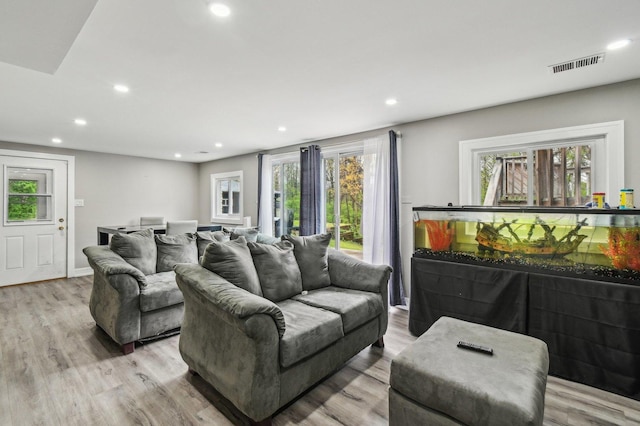 11702 Center Dr, Lemont, IL 60439 - living area with recessed lighting, visible vents, and wood finished floors