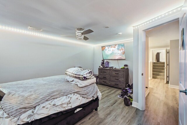 11702 Center Dr, Lemont, IL 60439 - bedroom with light wood-style flooring, baseboards, and ceiling fan