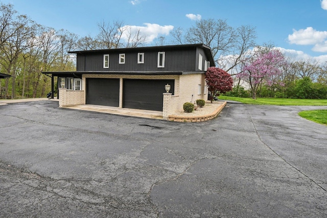 11702 Center Dr, Lemont, IL 60439 - view of property exterior featuring driveway and brick siding