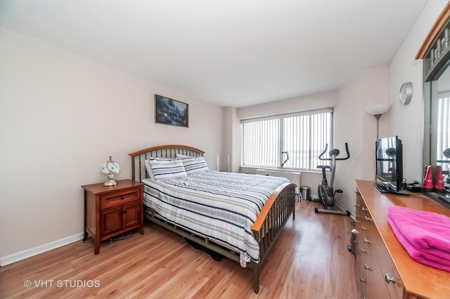 7061 N Kedzie Ave Unit 1409, Chicago, IL 60645 - bedroom with baseboards and light wood-type flooring