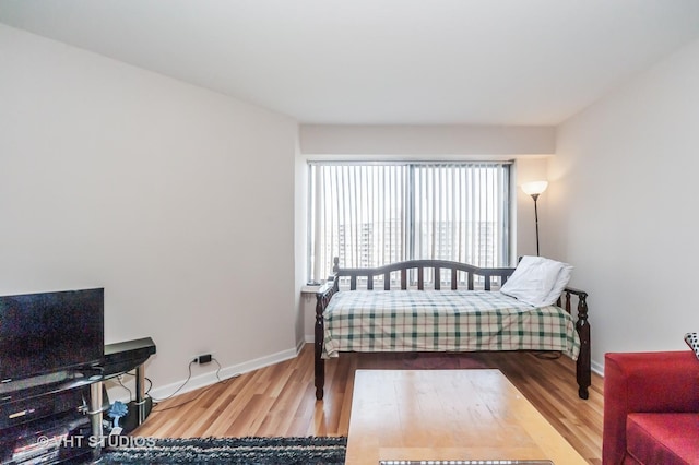 7061 N Kedzie Ave Unit 1409, Chicago, IL 60645 - bedroom with wood finished floors and baseboards