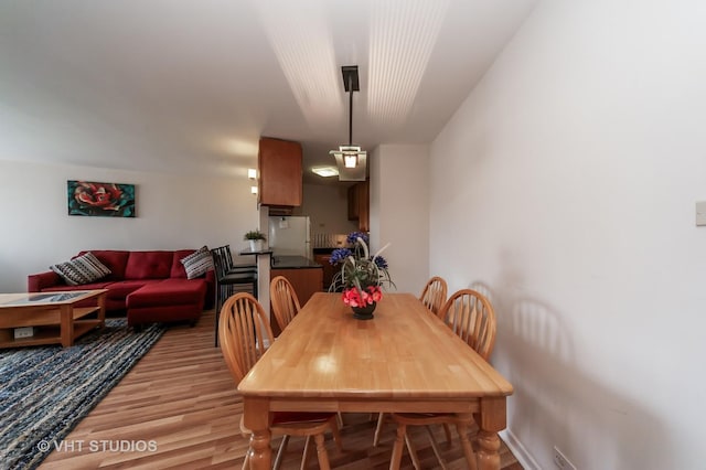 7061 N Kedzie Ave Unit 1409, Chicago, IL 60645 - dining area featuring light wood-style flooring