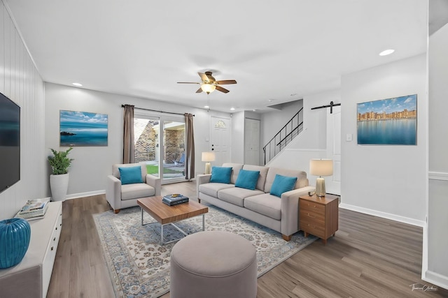 7808 Woodward Ave Unit 41-4G, Woodridge, IL 60517 - living area with a ceiling fan, wood finished floors, stairs, a barn door, and baseboards