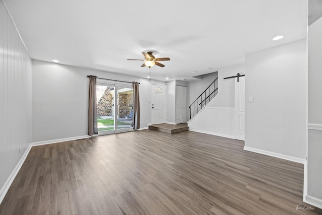 7808 Woodward Ave Unit 41-4G, Woodridge, IL 60517 - unfurnished living room featuring ceiling fan, wood finished floors, a barn door, baseboards, and recessed lighting