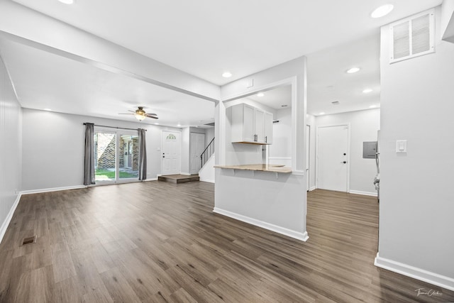 7808 Woodward Ave Unit 41-4G, Woodridge, IL 60517 - unfurnished living room with stairs, dark wood finished floors, baseboards, a ceiling fan, and recessed lighting