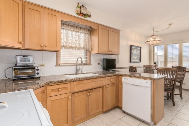 7313 W Howard Ave, Chicago, IL 60631 - kitchen featuring light tile patterned floors, a wealth of natural light, dishwasher, and a sink