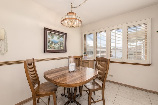 7313 W Howard Ave, Chicago, IL 60631 - dining space with a chandelier, baseboards, and light tile patterned floors