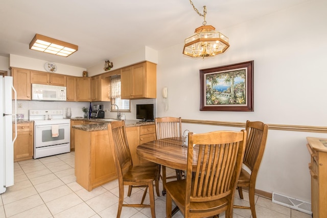 7313 W Howard Ave, Chicago, IL 60631 - kitchen featuring a chandelier, light tile patterned floors, visible vents, a peninsula, and white appliances