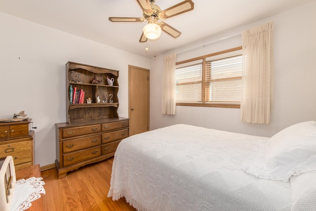 7313 W Howard Ave, Chicago, IL 60631 - bedroom with light wood-style floors, ceiling fan, and baseboards