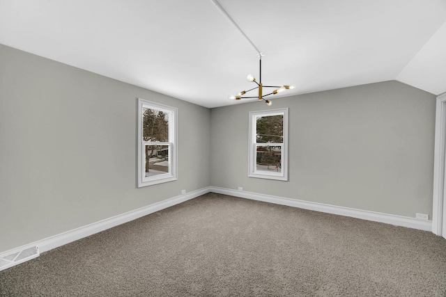 unfurnished room featuring visible vents, carpet flooring, a chandelier, and a healthy amount of sunlight