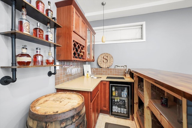 1730 W Diversey Pkwy Unit 1E, Chicago, IL 60614 - indoor wet bar featuring beverage cooler, decorative backsplash, light tile patterned flooring, and decorative light fixtures