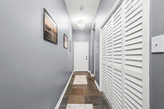 1730 W Diversey Pkwy Unit 1E, Chicago, IL 60614 - corridor with stone tile flooring and baseboards