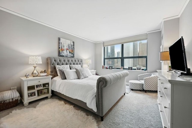 bedroom featuring crown molding and light carpet