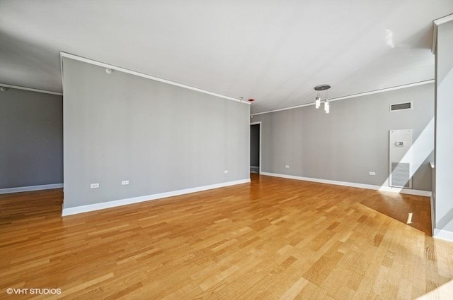 unfurnished living room with baseboards, light wood-type flooring, and visible vents