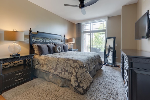 bedroom featuring ceiling fan and baseboards