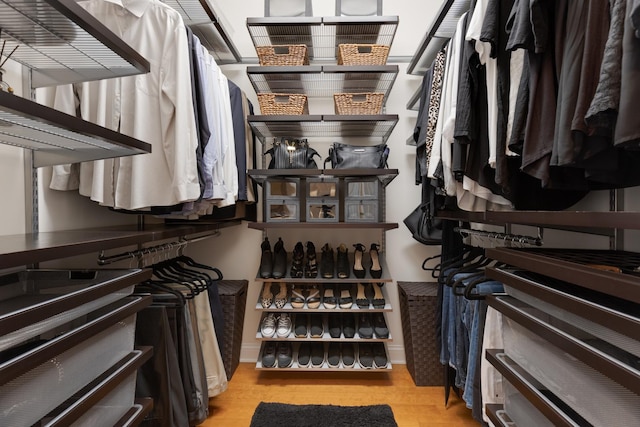 spacious closet featuring wood finished floors