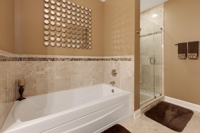 bathroom with a garden tub and a shower stall