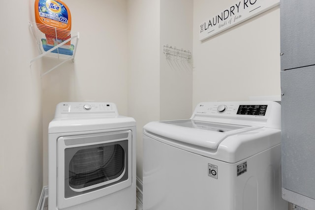 laundry area featuring washer and clothes dryer and laundry area